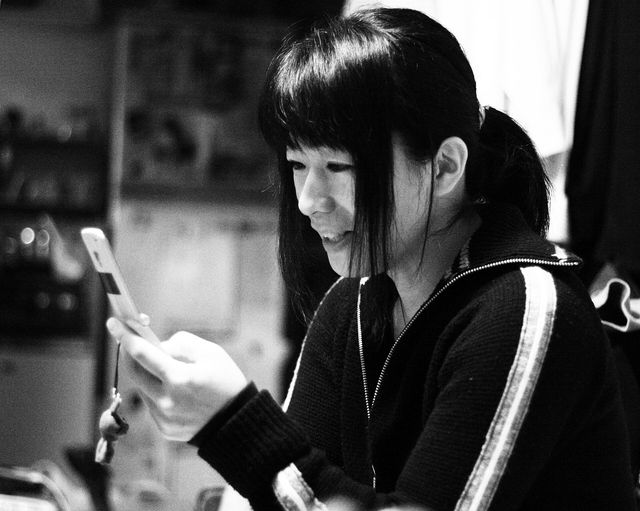 A Japanese woman with a mobile phone. (N.B. Uploading permission was granted by the woman depicted in the image.)